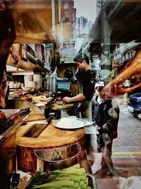 People at market stall in city