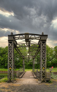 Metal gate bridge against sky