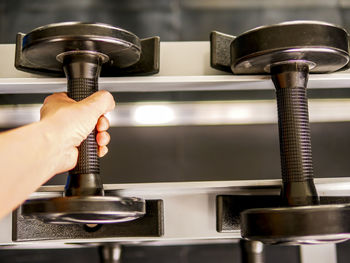 Close-up of hand holding dumbbell