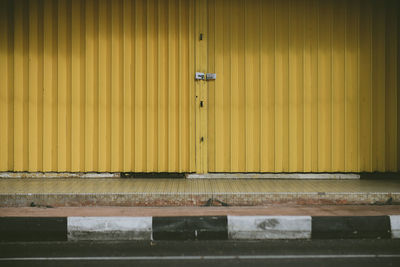 Yellow old shop lot door