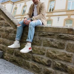 Low angle view of man sitting on steps