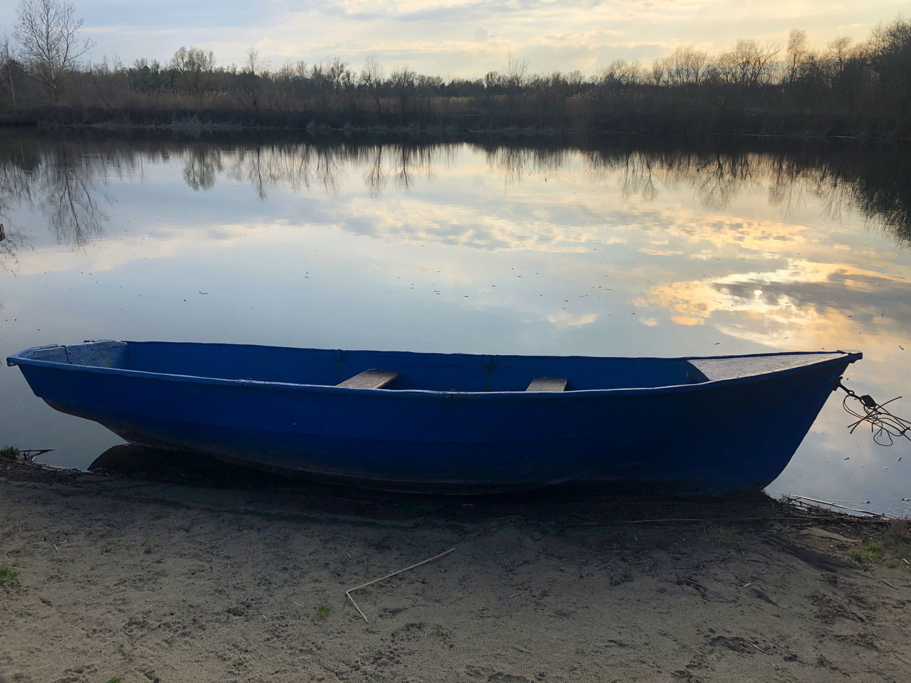 water, boat, nautical vessel, reflection, lake, transportation, vehicle, tranquility, nature, mode of transportation, moored, tranquil scene, rowboat, sky, beach, scenics - nature, canoe, beauty in nature, no people, land, watercraft, tree, non-urban scene, skiff, dinghy, outdoors, shore, cloud, boating, travel, plant, lakeshore, day, idyllic, landscape, sand, sunset