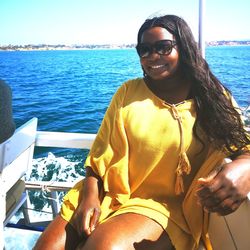 Portrait of smiling young woman in sea