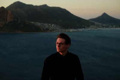 Young man standing on mountain