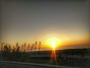 Scenic view of silhouette landscape against sky during sunset