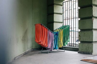 Multi colored towels drying by window