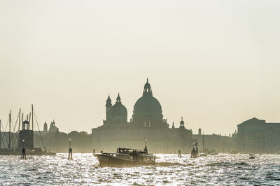 Boats in temple against clear sky