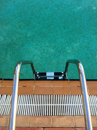 Close-up of ladder in swimming pool