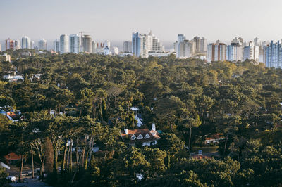 View of trees and buildings against sky