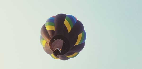 Low angle view of balloons against white background