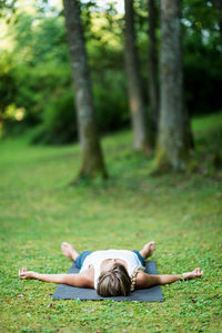 Woman lying on field