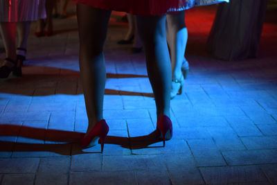 Low section of women dancing at nightclub