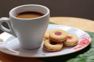 Close-up of coffee served on table