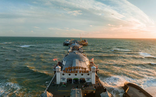 Aerial view of brighton palace pier, with the seafront behind.