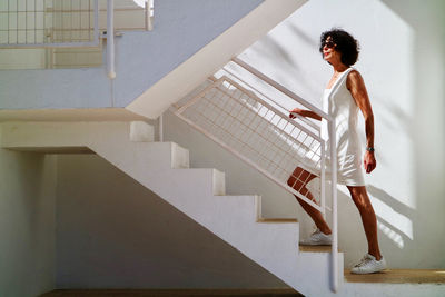 Woman walking on staircase