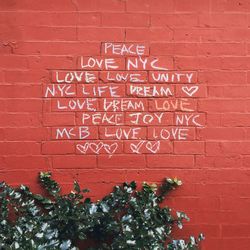 Text on brick wall