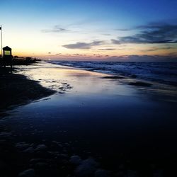 Scenic view of sea against sky at sunset