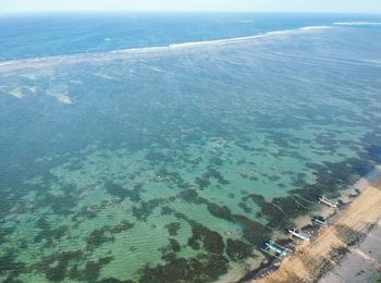 High angle view of sea shore against sky