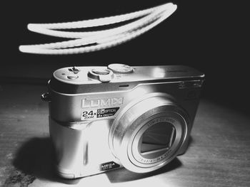 Close-up of camera on table