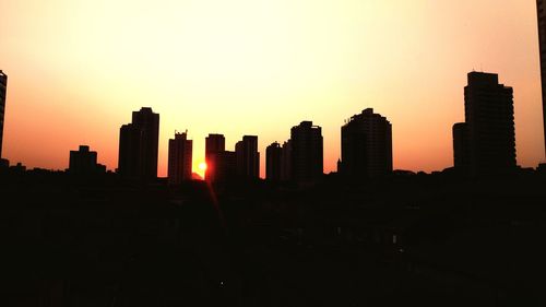 Silhouette of city at sunset