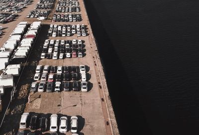 High angle view of cars parked at harbor