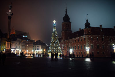 Illuminated buildings in city at night