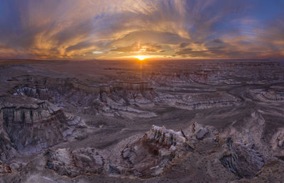 Epic sunrise aerial panorama above massive coal mine canyon on n