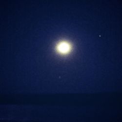 Scenic view of moon against sky at night