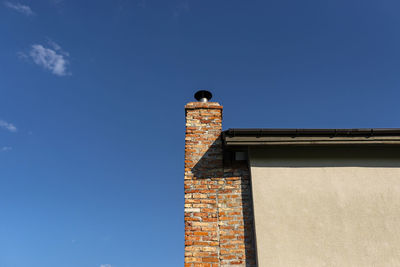 Low angle view of building against blue sky