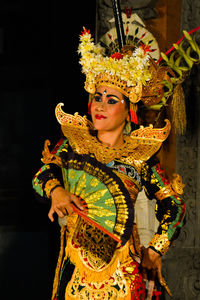 Portrait of young woman in traditional clothing