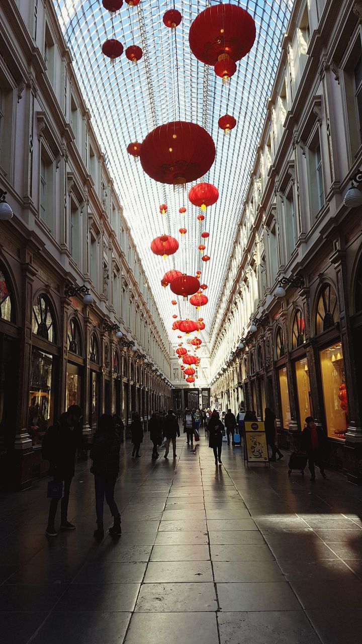 large group of people, architecture, men, built structure, women, lantern, indoors, day, city, people