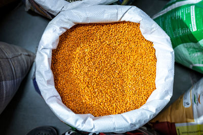 Red lentil for sale at retail shop from top angle at day