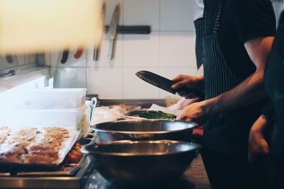 Chef preparing food at kitchen counter