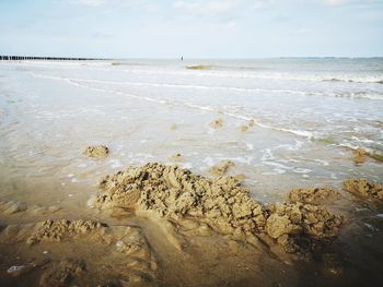 Scenic view of beach against sky