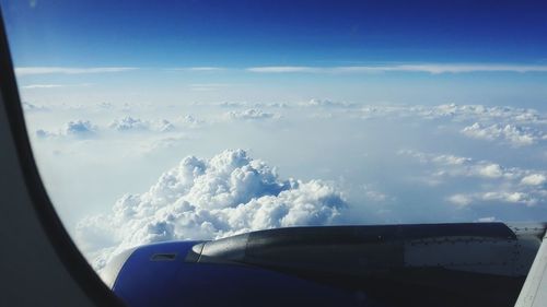 Aerial view of landscape against cloudy sky