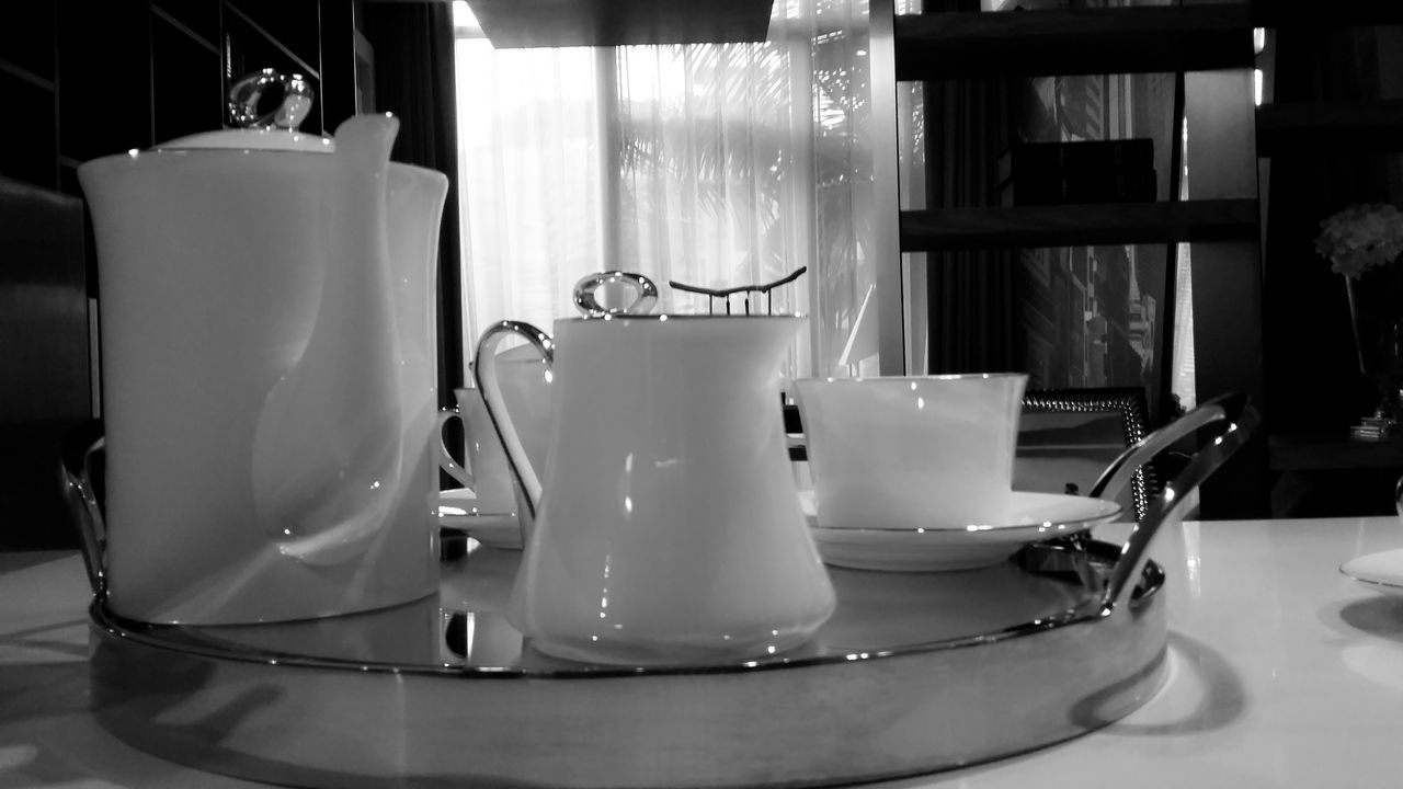 indoors, table, still life, chair, home interior, empty, absence, no people, close-up, domestic room, room, coffee cup, restaurant, furniture, plate, focus on foreground, technology, home, reflection, illuminated