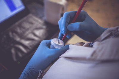 Close-up of doctor working in medical clinic