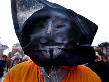 Close-up of man wearing mask during festival