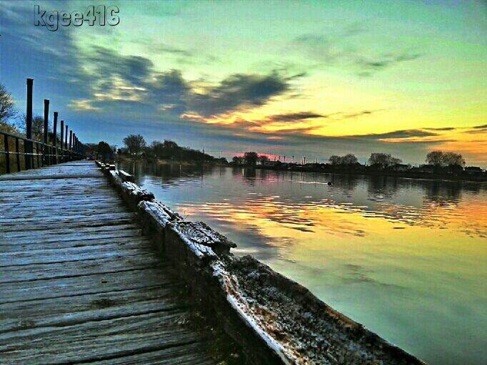 water, sunset, sky, pier, scenics, tranquil scene, beauty in nature, tranquility, lake, cloud - sky, nature, river, reflection, built structure, orange color, the way forward, jetty, idyllic, railing, wood - material