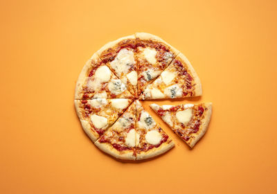 Directly above shot of pizza against white background