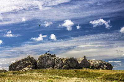 Scenic view of rocks on land against sky