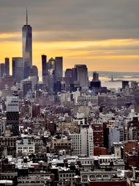 Cityscape against sky during sunset