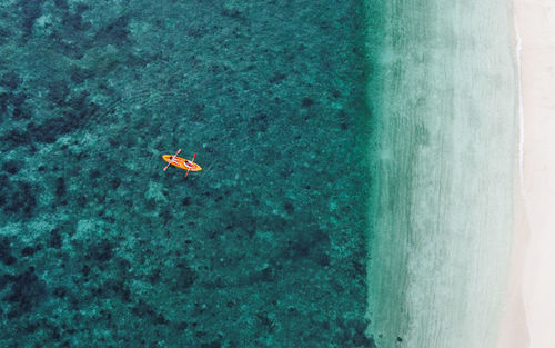 High angle view of kayaking in sea