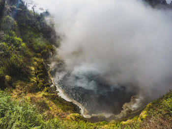 Smoke emitting from volcanic mountain