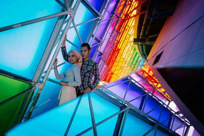 Low angle view of people at amusement park