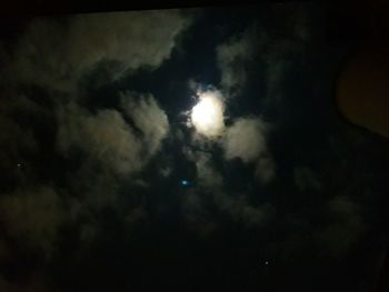 Low angle view of moon in sky at night