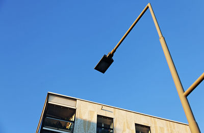 Low angle view of building against clear blue sky