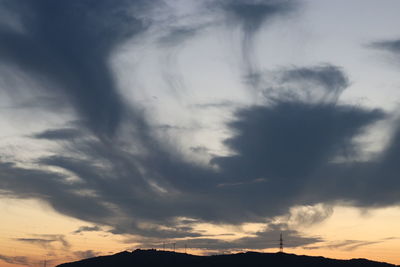 Low angle view of cloudy sky during sunset