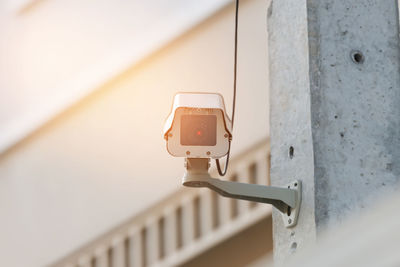 Close-up of security camera on building
