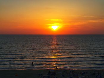 Scenic view of sea against romantic sky at sunset